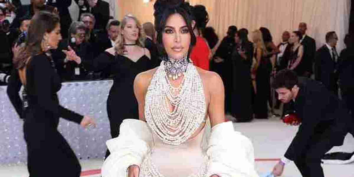 Watch out, Kim! Shocked Kardashian nearly falls victim to her perilously placed pearls - which have been ripped to shred