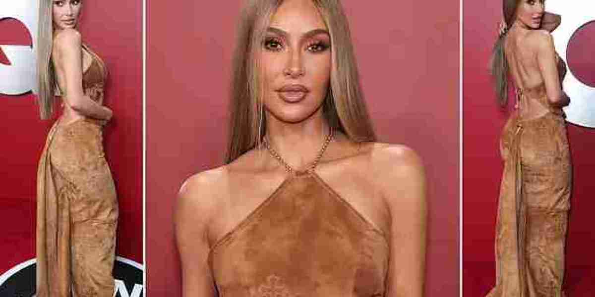 Kim Kardashian ditches drag king look for sultry dress and long blonde hair on red carpet to celebrate landing controver
