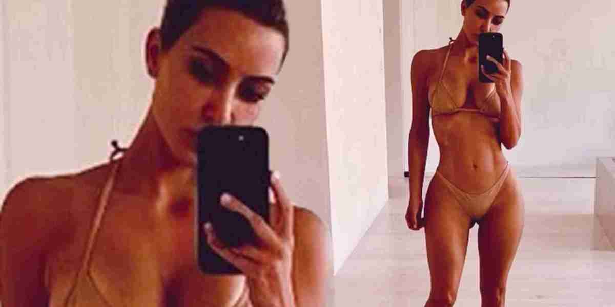 Kim Kardashian flaunts her bombshell body in a tan bikini... after revealing she 'is more open to dating again'