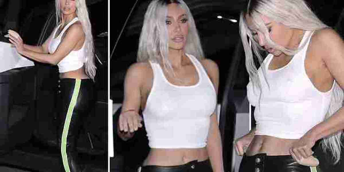 Kim Kardashian debuts new platinum blonde hair and shows off toned midriff in crop top and leather pants during night ou