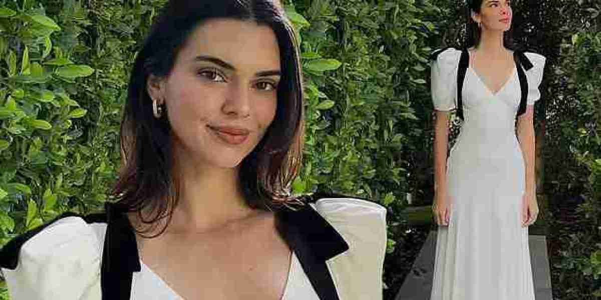 Kendall Jenner is a vision in plunging white gown as she shares stunning snaps from her Easter celebration: 'Dress 